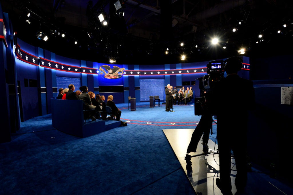 Moments before the candidates appear, members of the Commission on Presidential Debates welcome participants to the town hall at Washington University in St. Louis. (Photo: Joe Angeles/Washington University)